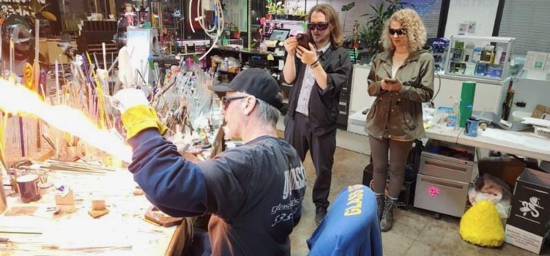 Tim Bohr demonstrating while audience members film on phones